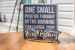 photo of a sign and eyeglasses on table